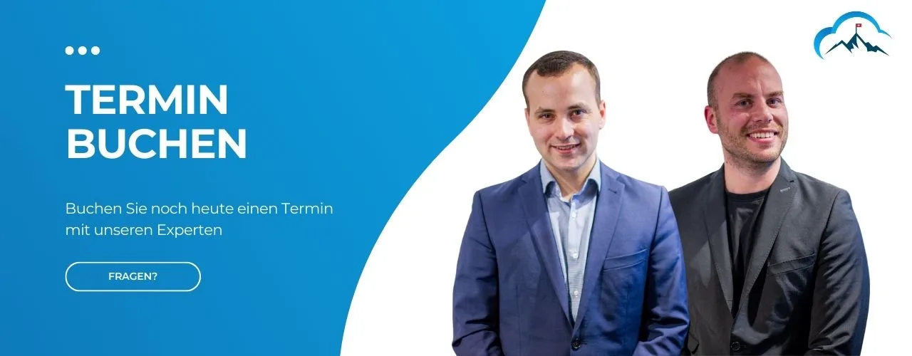 A promotional banner for booking appointments. The left side has white text on a blue background reading "TERMIN BUCHEN" (Book an appointment) with a subtitle "Buchen Sie noch heute einen Termin mit unseren Experten" (Book an appointment with our experts today) and a "FRAGEN?" (Questions?) button. The right side shows two smiling men in business attire - one in a blue suit and light shirt, the other in a black suit and shirt. A stylized mountain logo is in the top right corner.